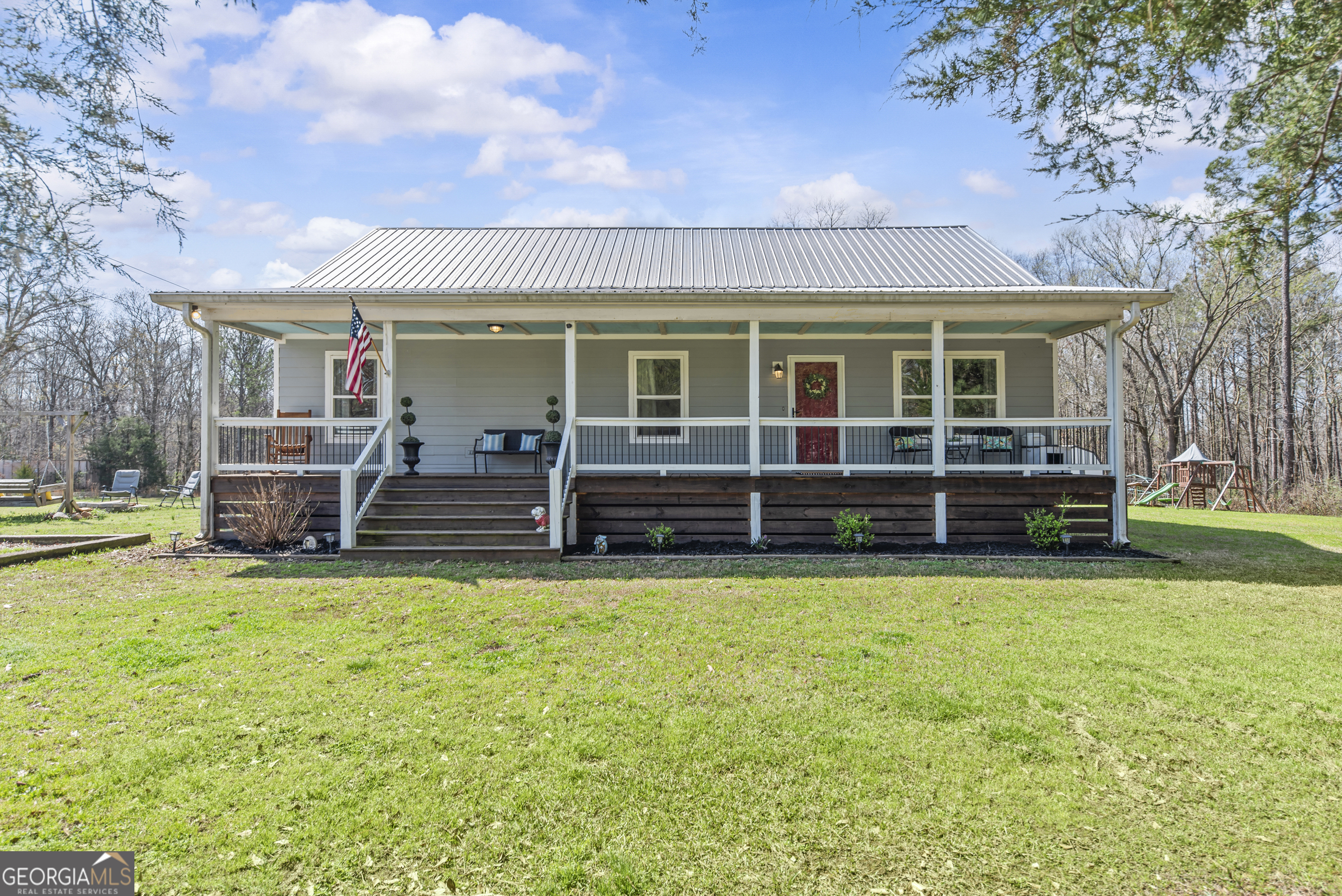 1687 Leon Ellis Road Hull, GA 30646 - Photo 2 of 51 a view of a house with a yard and sitting area