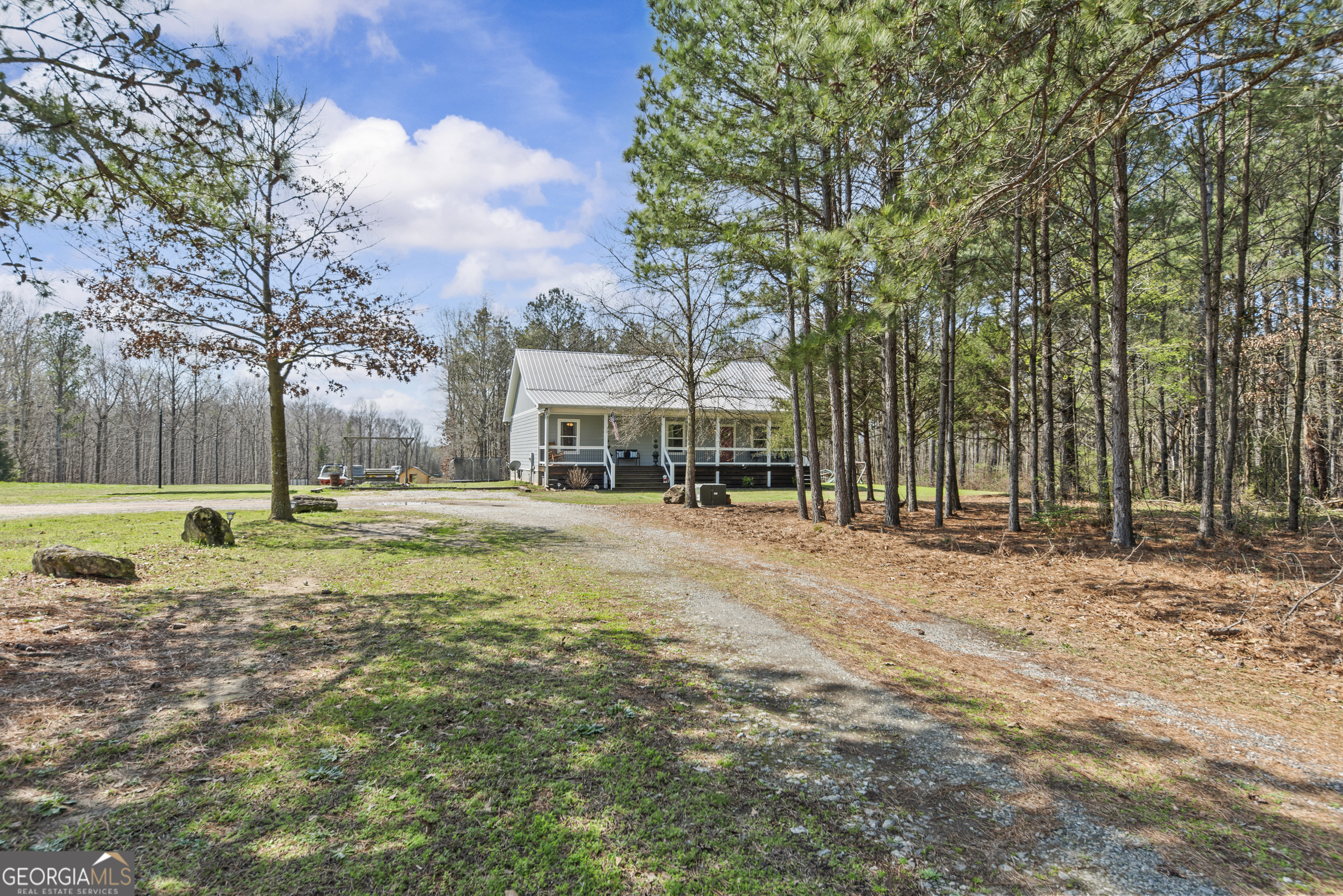 1687 Leon Ellis Road Hull, GA 30646 - Photo 22 of 51 a view of a house with a yard and sitting area