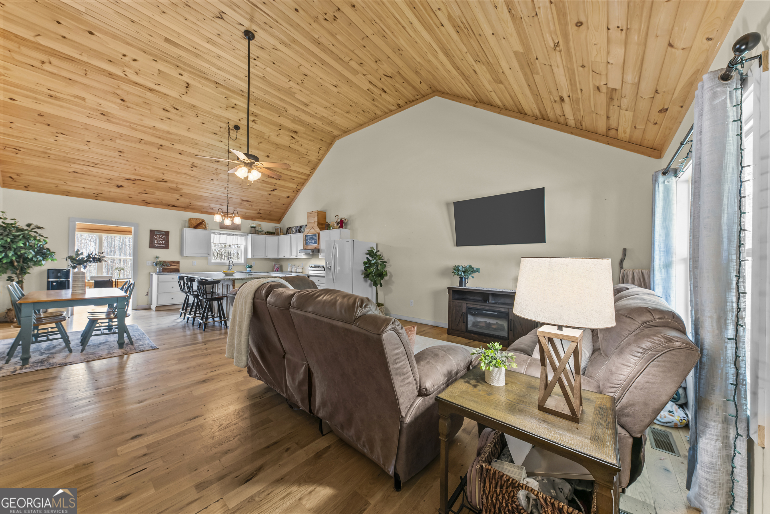 1687 Leon Ellis Road Hull, GA 30646 - Photo 24 of 51 a living room with furniture and a flat screen tv