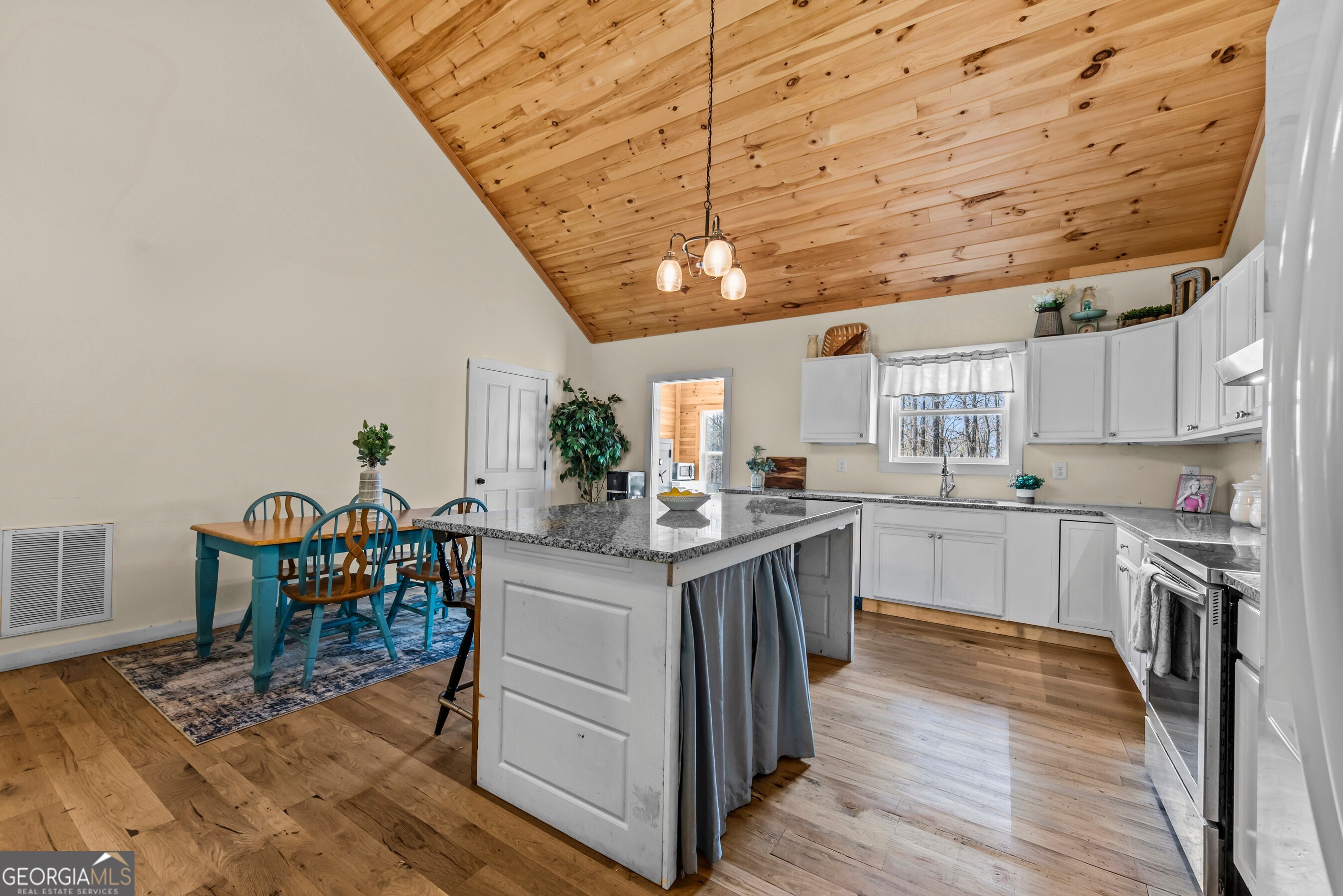 1687 Leon Ellis Road Hull, GA 30646 - Photo 26 of 51 a kitchen with granite countertop a wooden cabinets and counter space