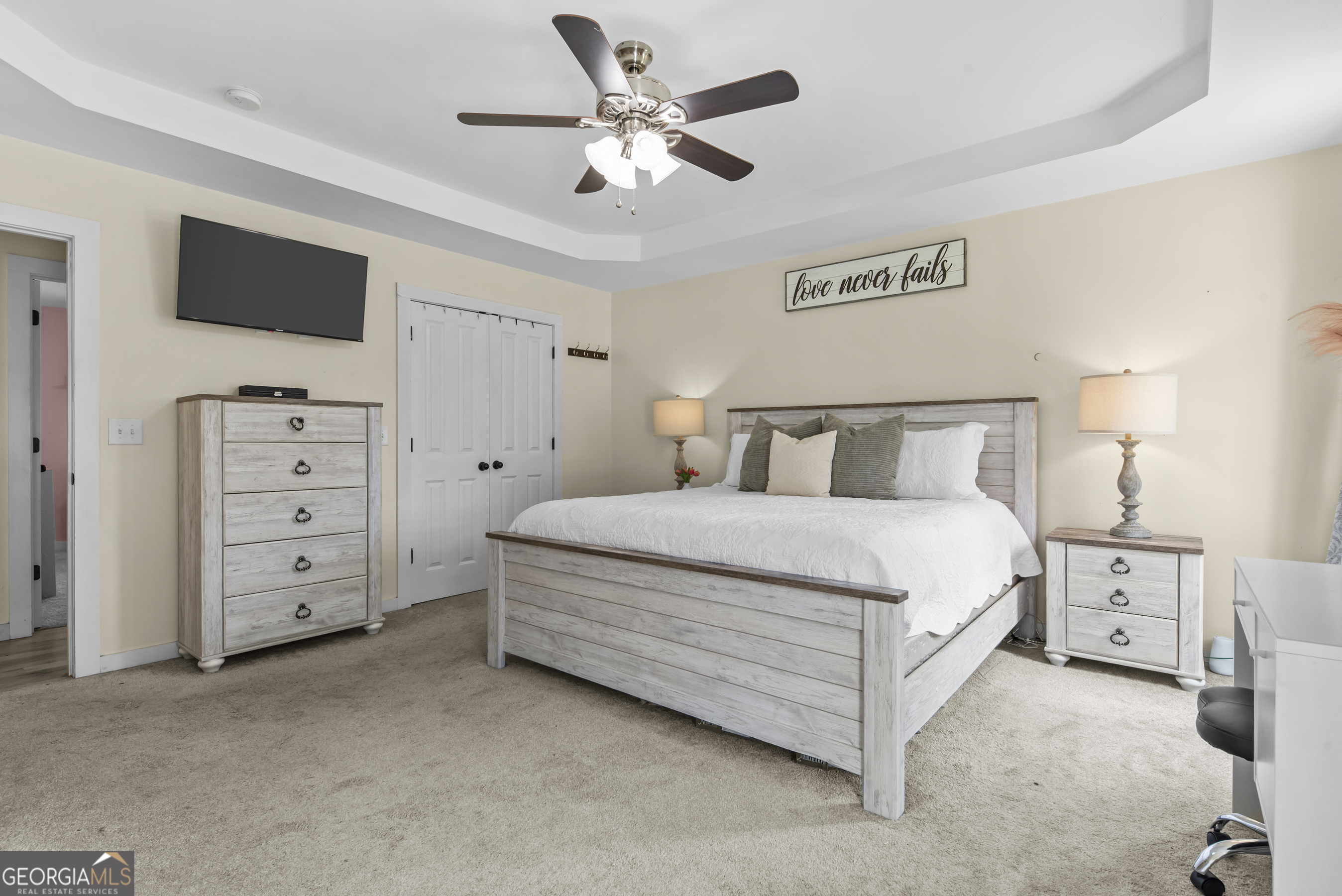 1687 Leon Ellis Road Hull, GA 30646 - Photo 30 of 51 a bedroom with a bed and a ceiling fan