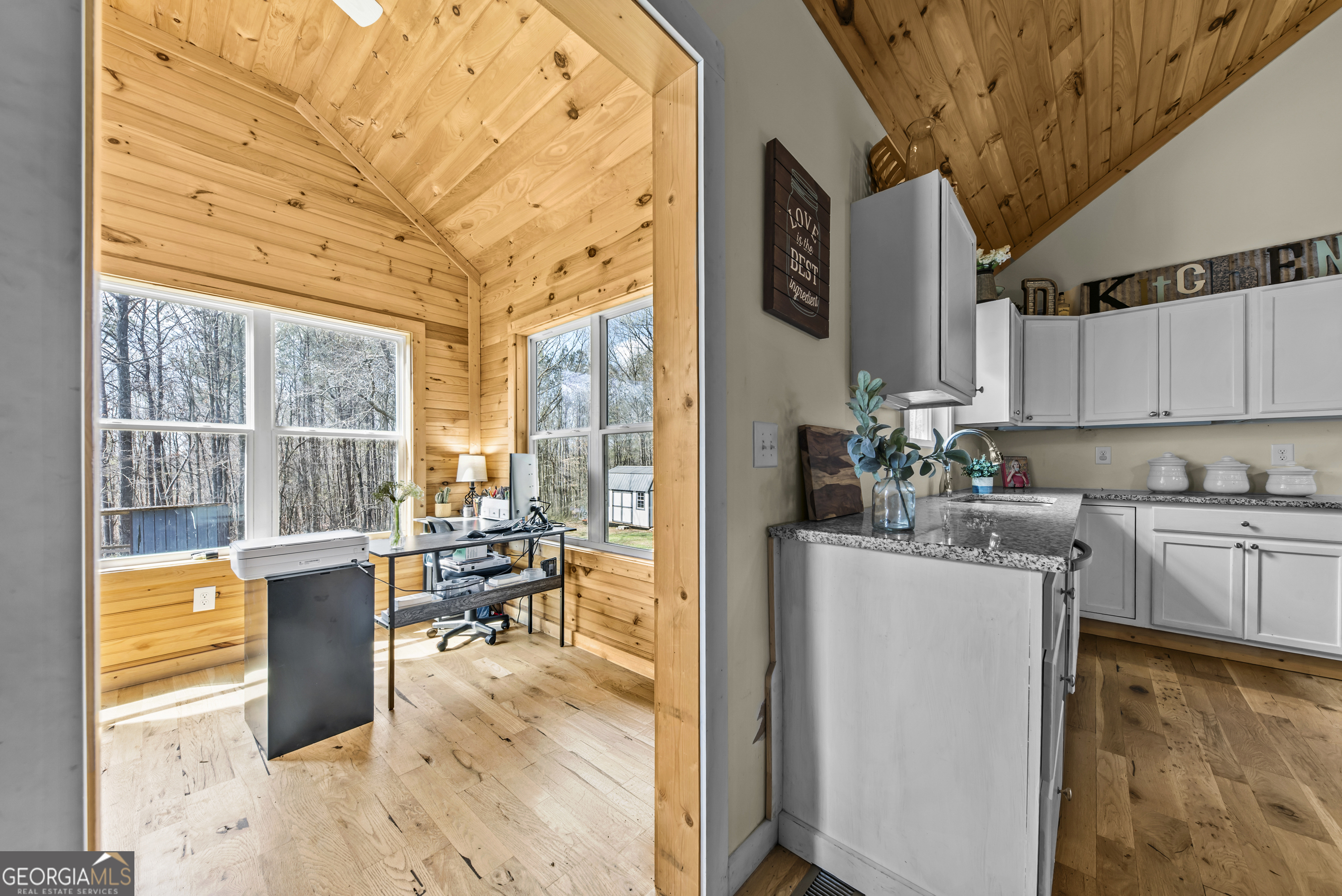 1687 Leon Ellis Road Hull, GA 30646 - Photo 34 of 51 a kitchen with stainless steel appliances kitchen island granite countertop a table and chairs in it