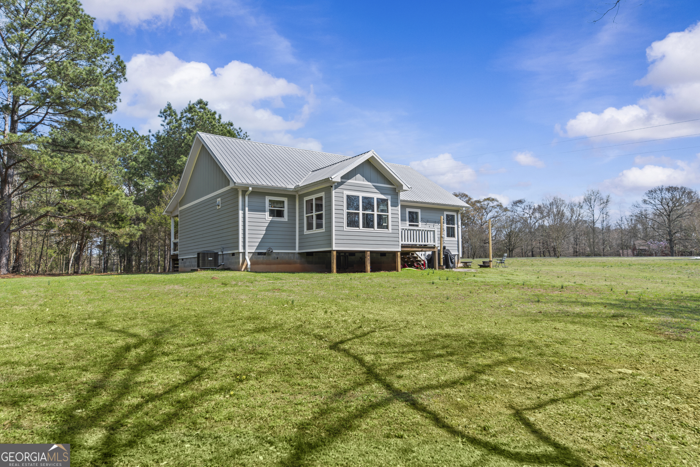 1687 Leon Ellis Road Hull, GA 30646 - Photo 35 of 51 a view of a big house with a big yard and large trees
