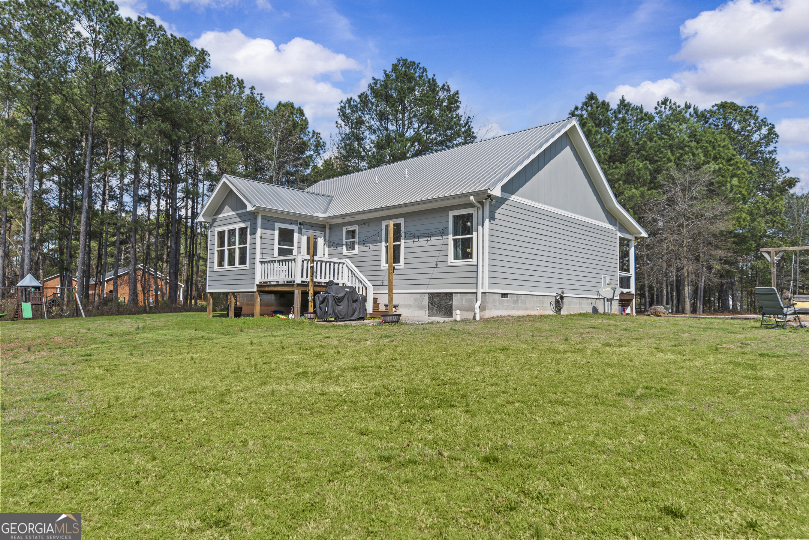 1687 Leon Ellis Road Hull, GA 30646 - Photo 36 of 51 a front view of a house with a garden