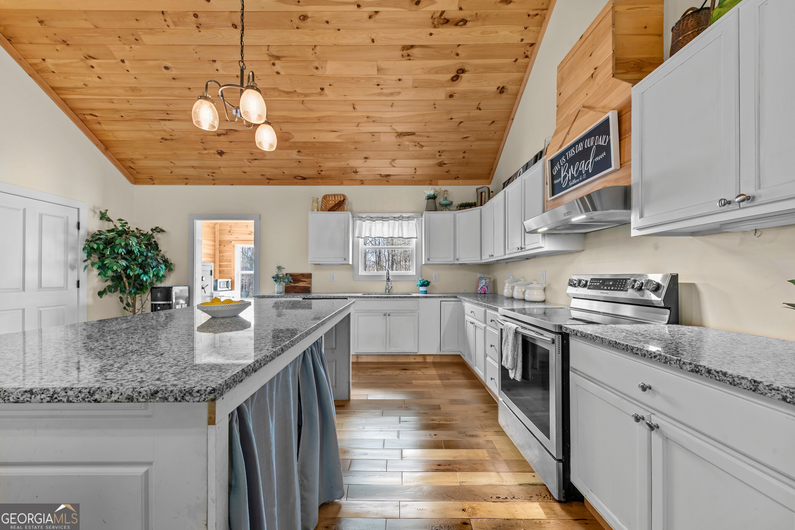 1687 Leon Ellis Road Hull, GA 30646 - Photo 7 of 51 a kitchen with stainless steel appliances granite countertop a sink and stove