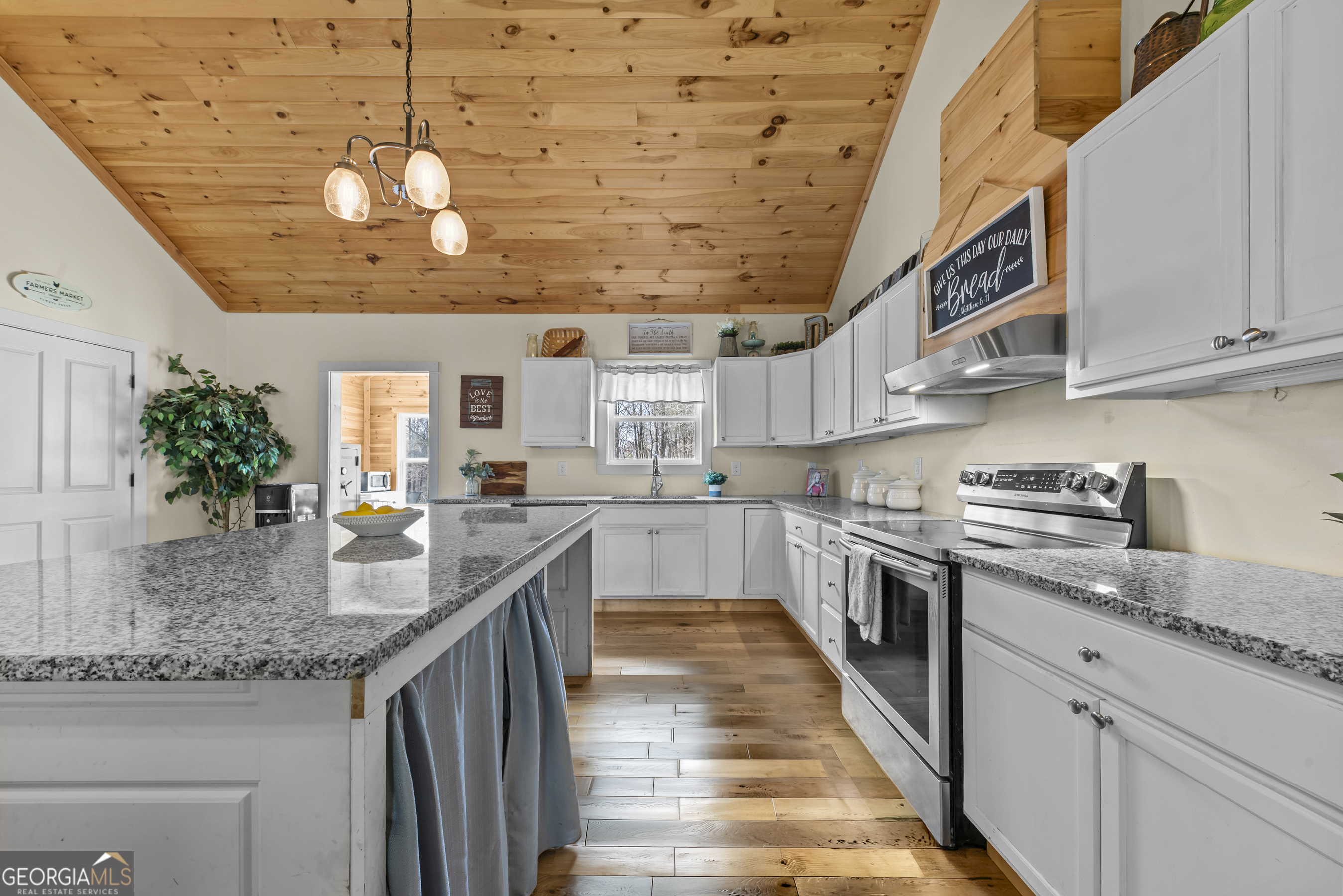 1687 Leon Ellis Road Hull, GA 30646 - Photo 8 of 51 a kitchen with stainless steel appliances granite countertop a sink and stove