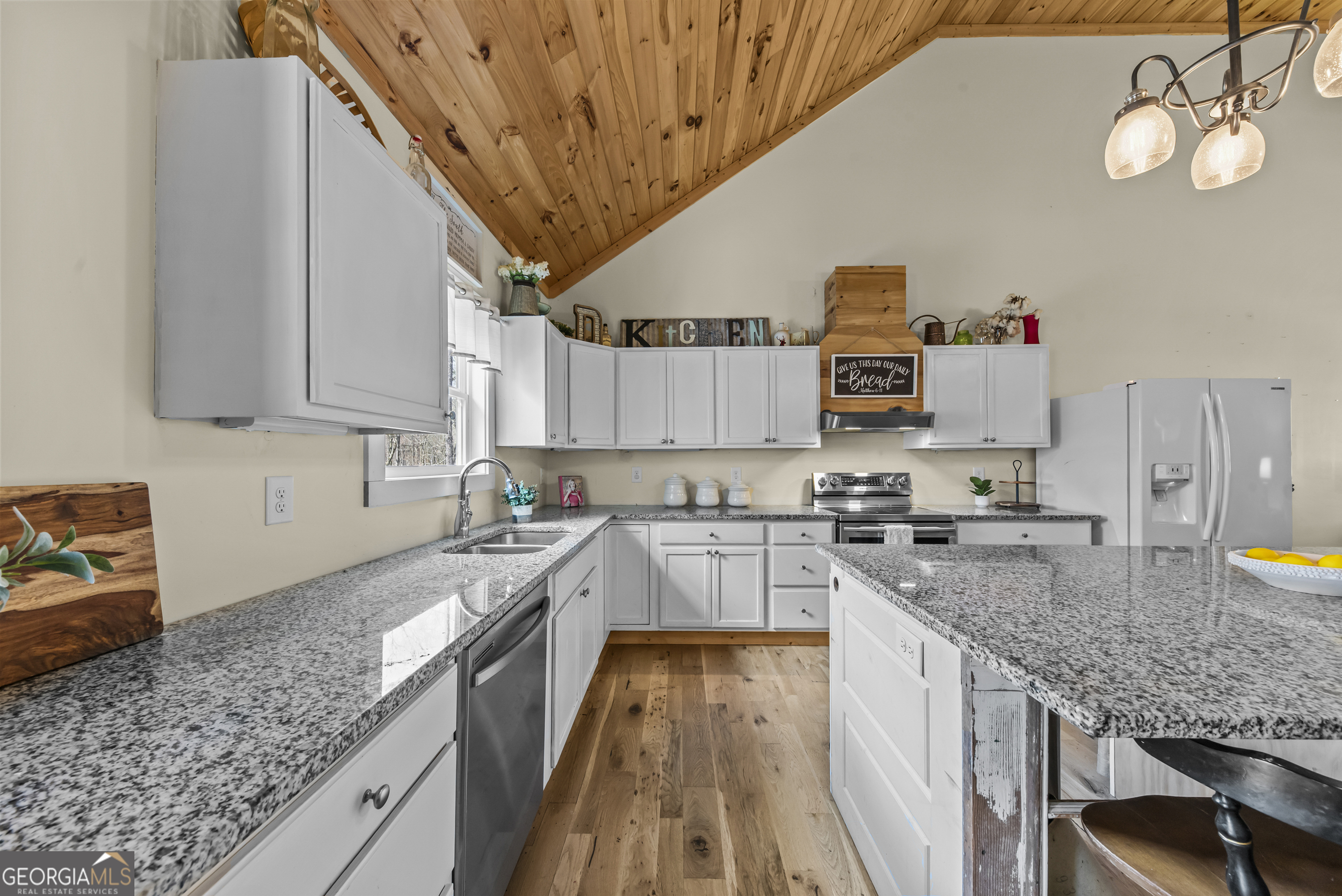 1687 Leon Ellis Road Hull, GA 30646 - Photo 10 of 51 a kitchen with a sink a stove and cabinets