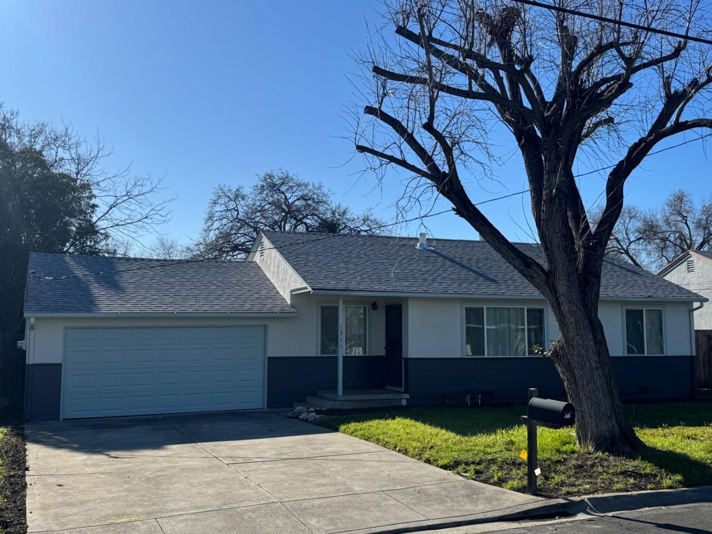 1311 Lexington Road Concord, CA 94520 - Photo 1 of 25 a front view of a house with yard and green space