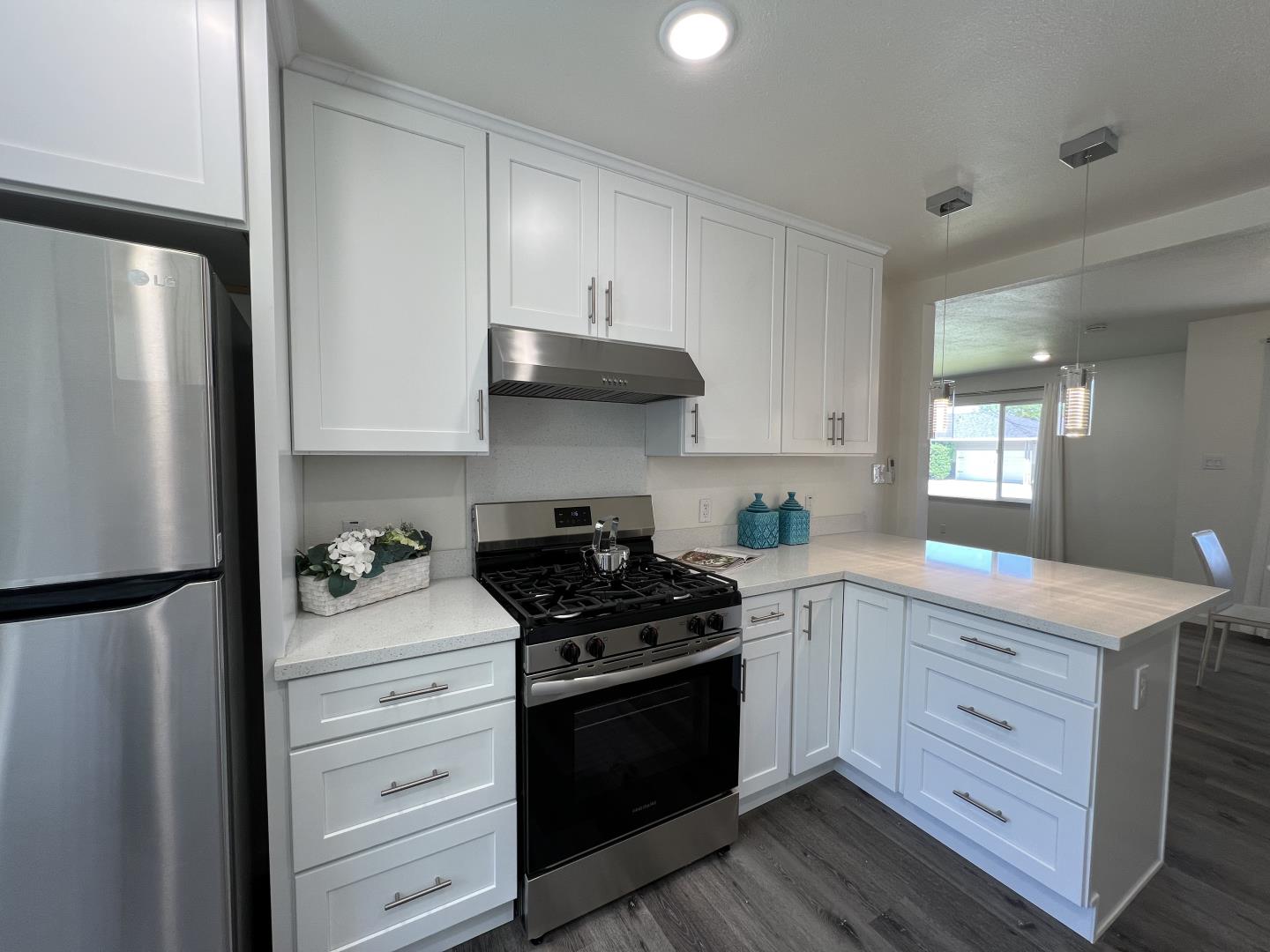 1311 Lexington Road Concord, CA 94520 - Photo 12 of 25 a kitchen with stainless steel appliances a stove a refrigerator and cabinets