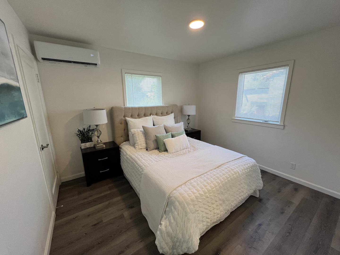 1311 Lexington Road Concord, CA 94520 - Photo 17 of 25 a bedroom with a bed and wooden floor