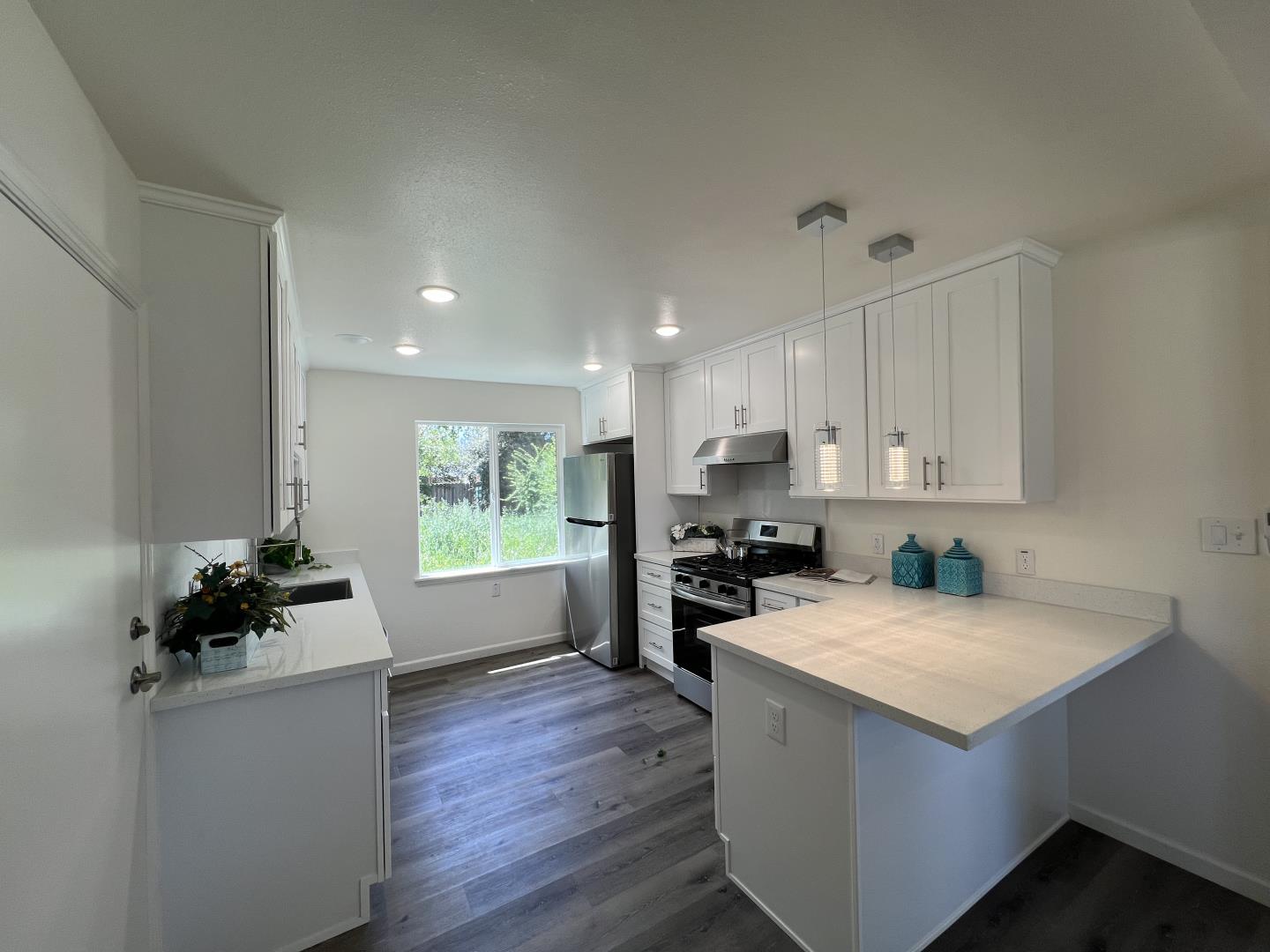 1311 Lexington Road Concord, CA 94520 - Photo 9 of 25 a kitchen with a refrigerator and a stove top oven