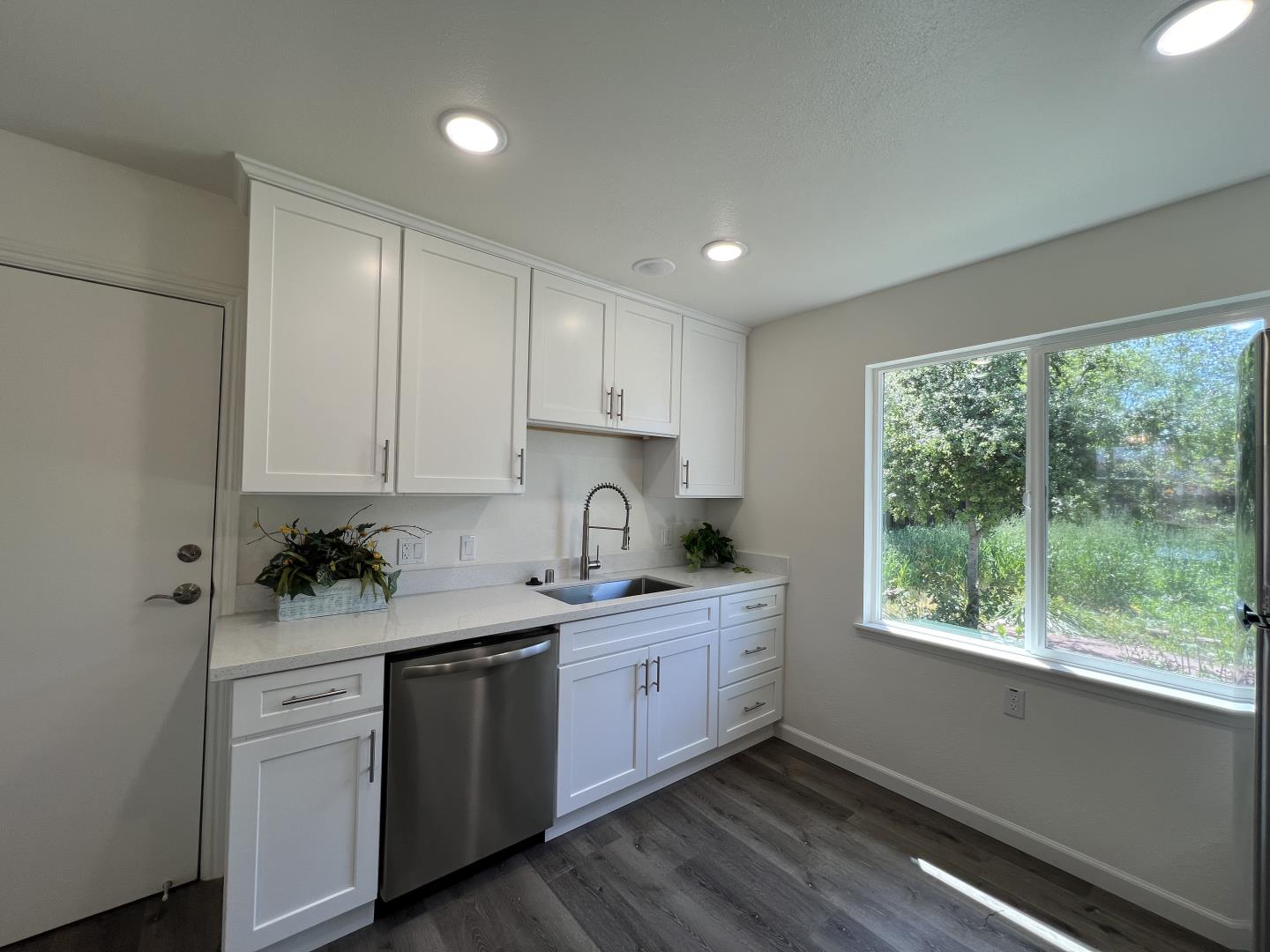 1311 Lexington Road Concord, CA 94520 - Photo 10 of 25 a kitchen with a sink cabinets appliances and a window