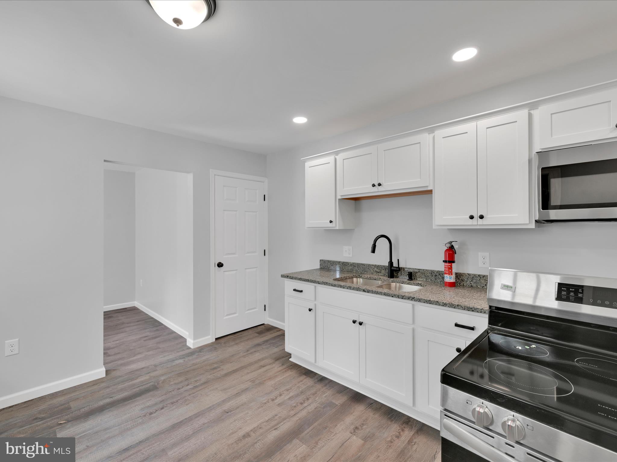 2 Suedberg Road Pine Grove, PA 17963 - Photo 12 of 22 a kitchen with granite countertop a stove and a sink