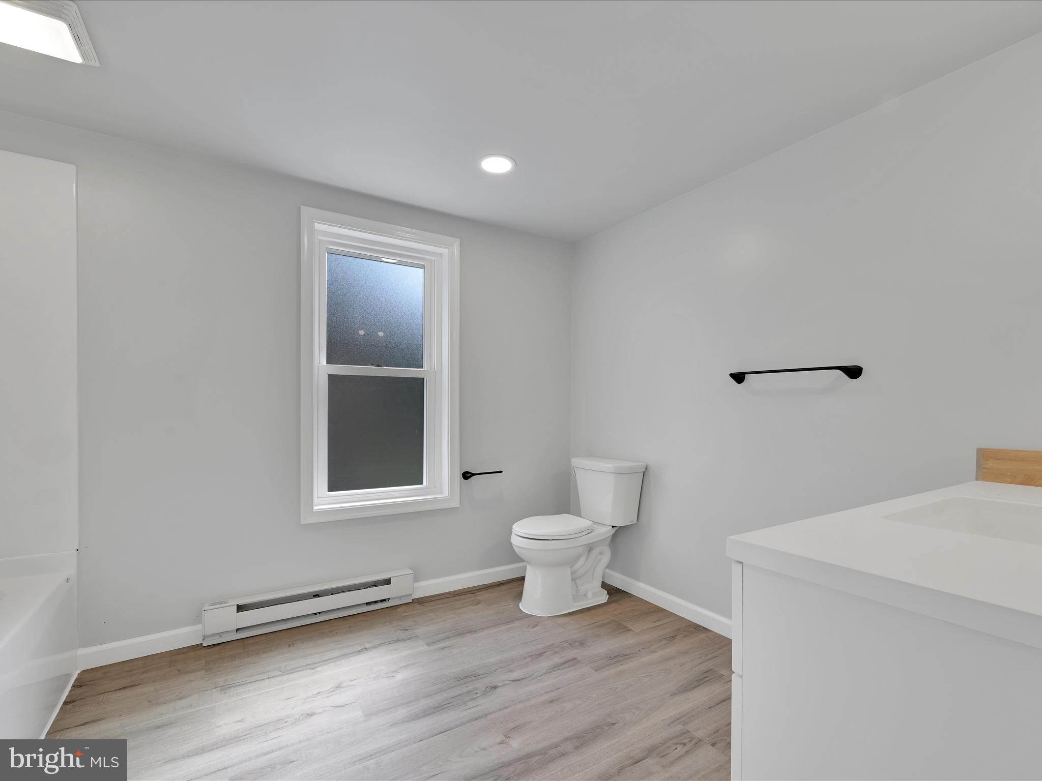 2 Suedberg Road Pine Grove, PA 17963 - Photo 17 of 22 a bathroom with a toilet a sink and a window
