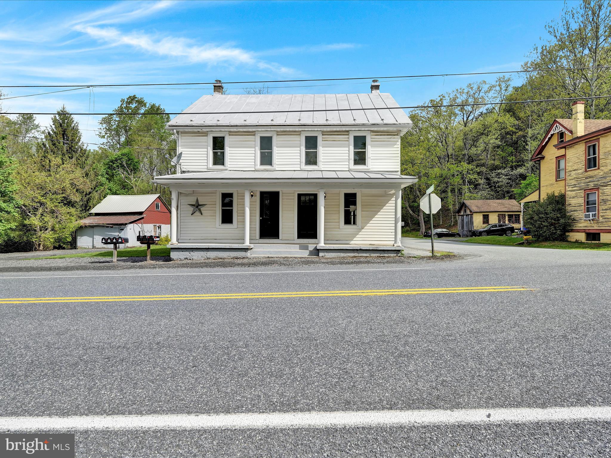 2 Suedberg Road Pine Grove, PA 17963 - Photo 3 of 22 a front view of a house with a garden and parking