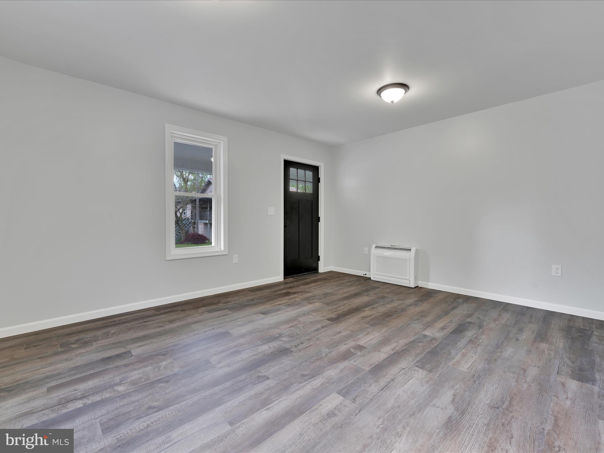 2 Suedberg Road Pine Grove, PA 17963 - Photo 7 of 22 a view of an empty room with wooden floor and a window