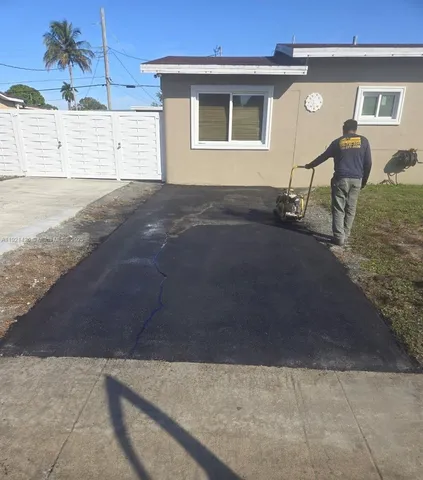a view of backyard with a table and chairs