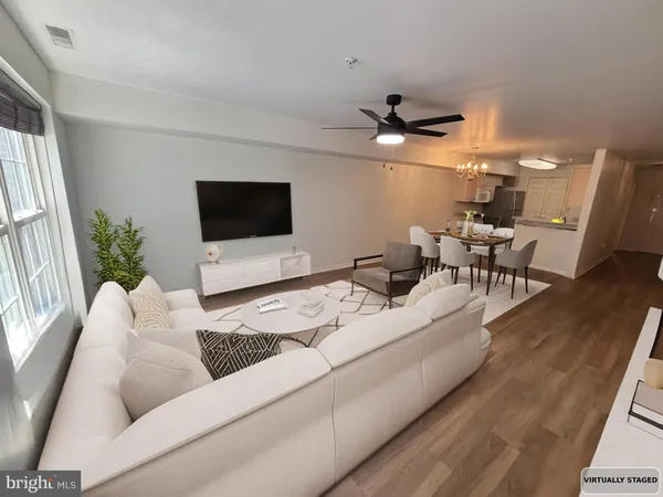 a bedroom with bed couch and window