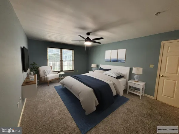a view of an empty room with a chandelier fan