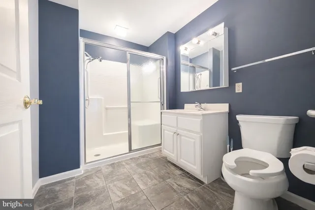 a bedroom with a bed and potted plant