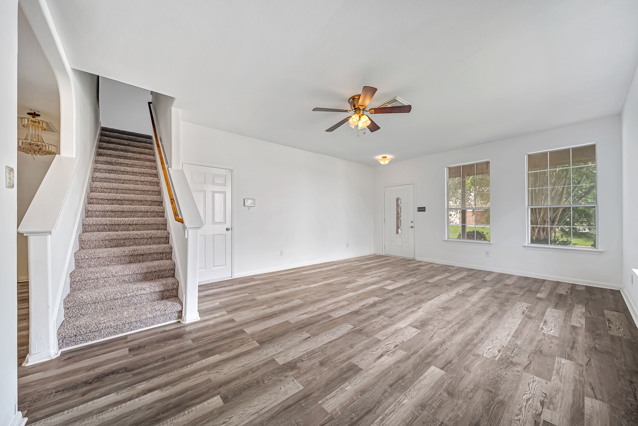 23526 Whispering Maple Drive Spring, TX 77373 - Photo 3 of 26 a view of an empty room with wooden floor and a window