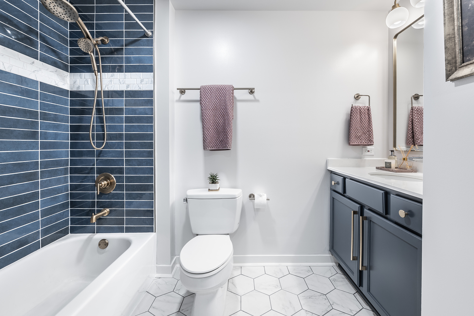909 West Washington Boulevard, Unit 701 Chicago, IL 60607 - Photo 11 of 25 a bathroom with a sink toilet and shower