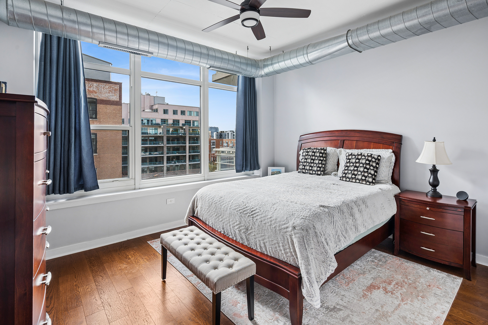 909 West Washington Boulevard, Unit 701 Chicago, IL 60607 - Photo 12 of 25 a bedroom with a bed and a window