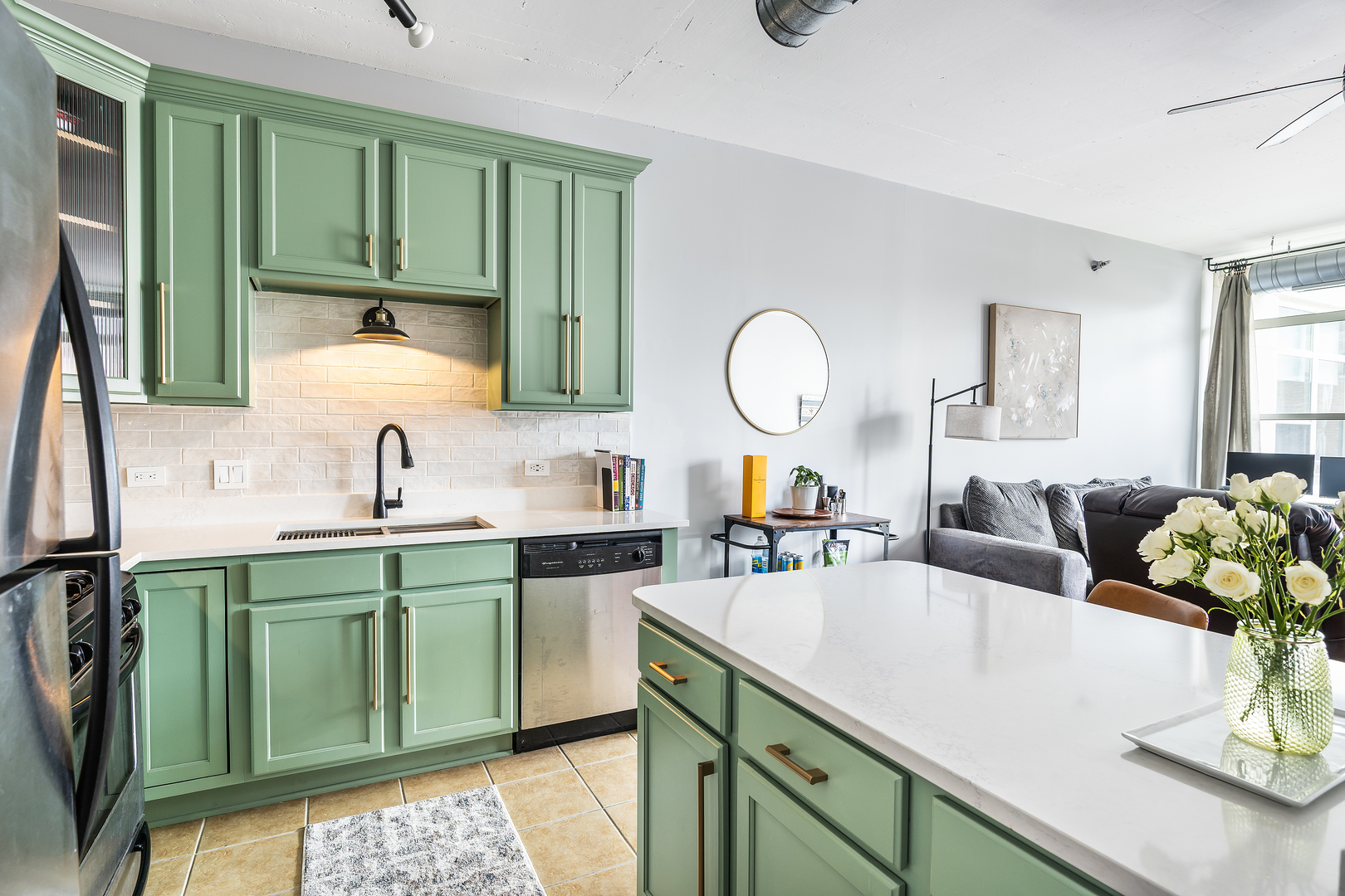 909 West Washington Boulevard, Unit 701 Chicago, IL 60607 - Photo 4 of 25 a kitchen with a sink a counter and cabinets