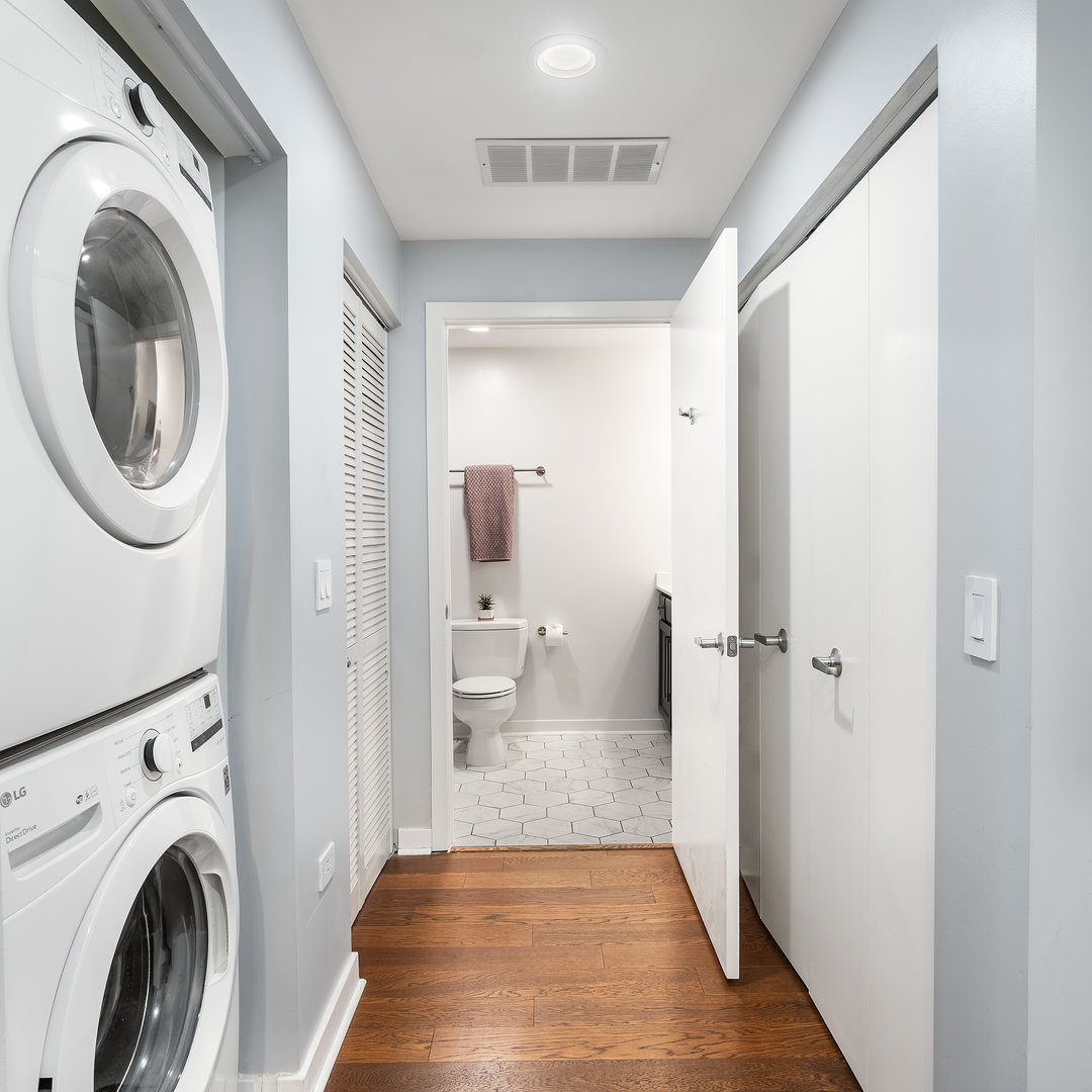 909 West Washington Boulevard, Unit 701 Chicago, IL 60607 - Photo 5 of 25 a view of a hallway with washer and dryer