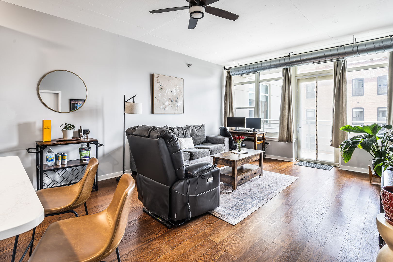 909 West Washington Boulevard, Unit 701 Chicago, IL 60607 - Photo 7 of 25 a living room with furniture fireplace and a large window