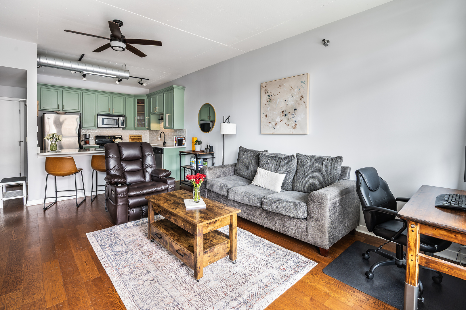 909 West Washington Boulevard, Unit 701 Chicago, IL 60607 - Photo 9 of 25 a living room with furniture and wooden floor