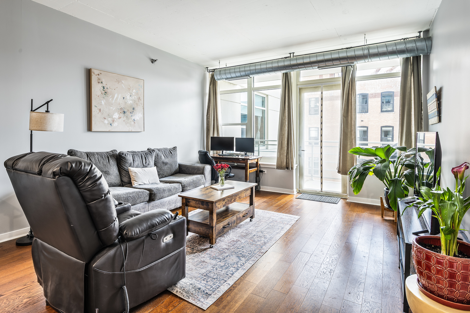 909 West Washington Boulevard, Unit 701 Chicago, IL 60607 - Photo 10 of 25 a living room with furniture and a large window