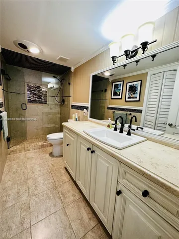 a bathroom with a sink a mirror and a toilet