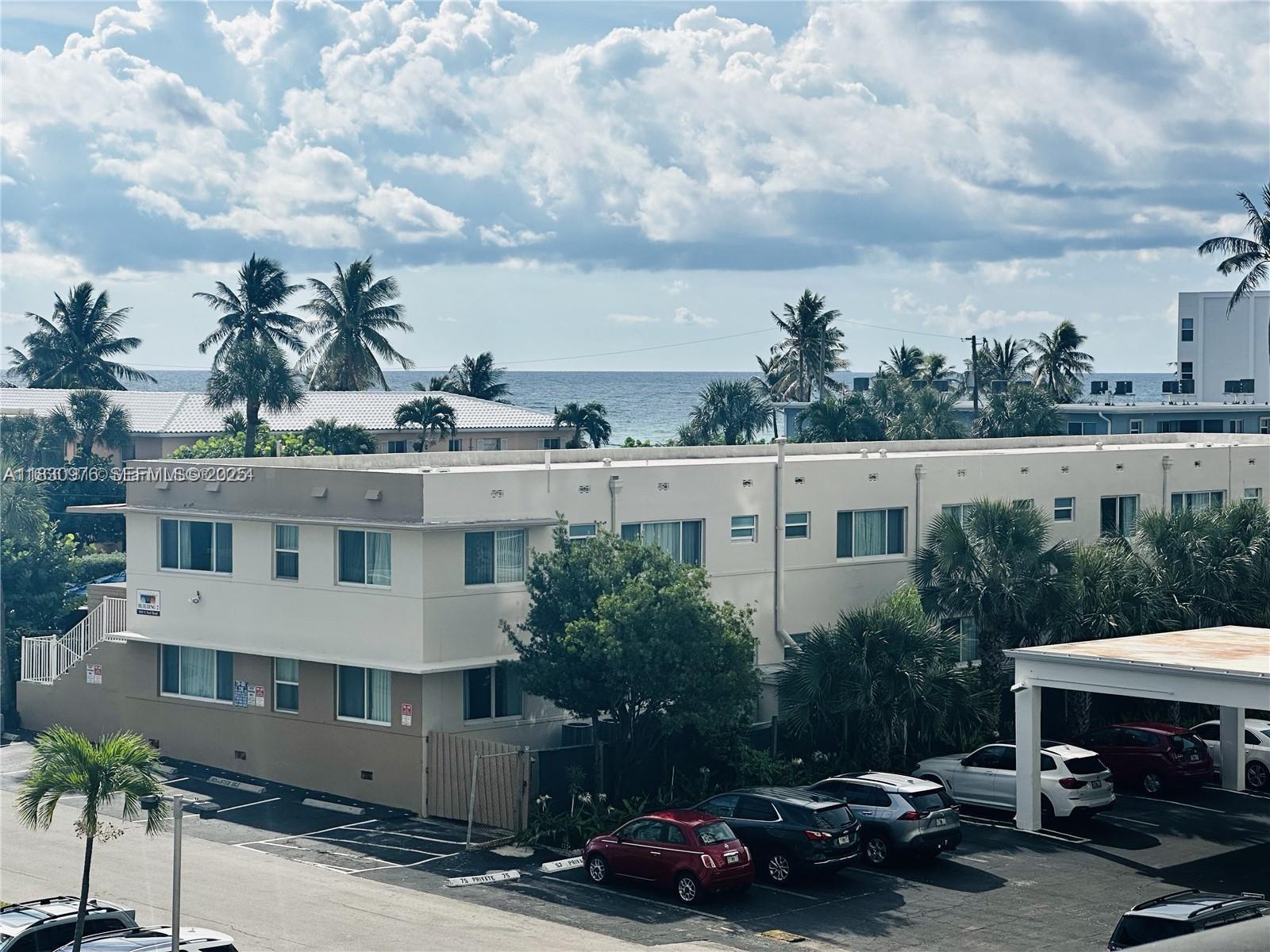1501 South Ocean Drive, Unit 406 Hollywood, FL 33019 - Photo 11 of 14 a couple of cars parked in front of a building