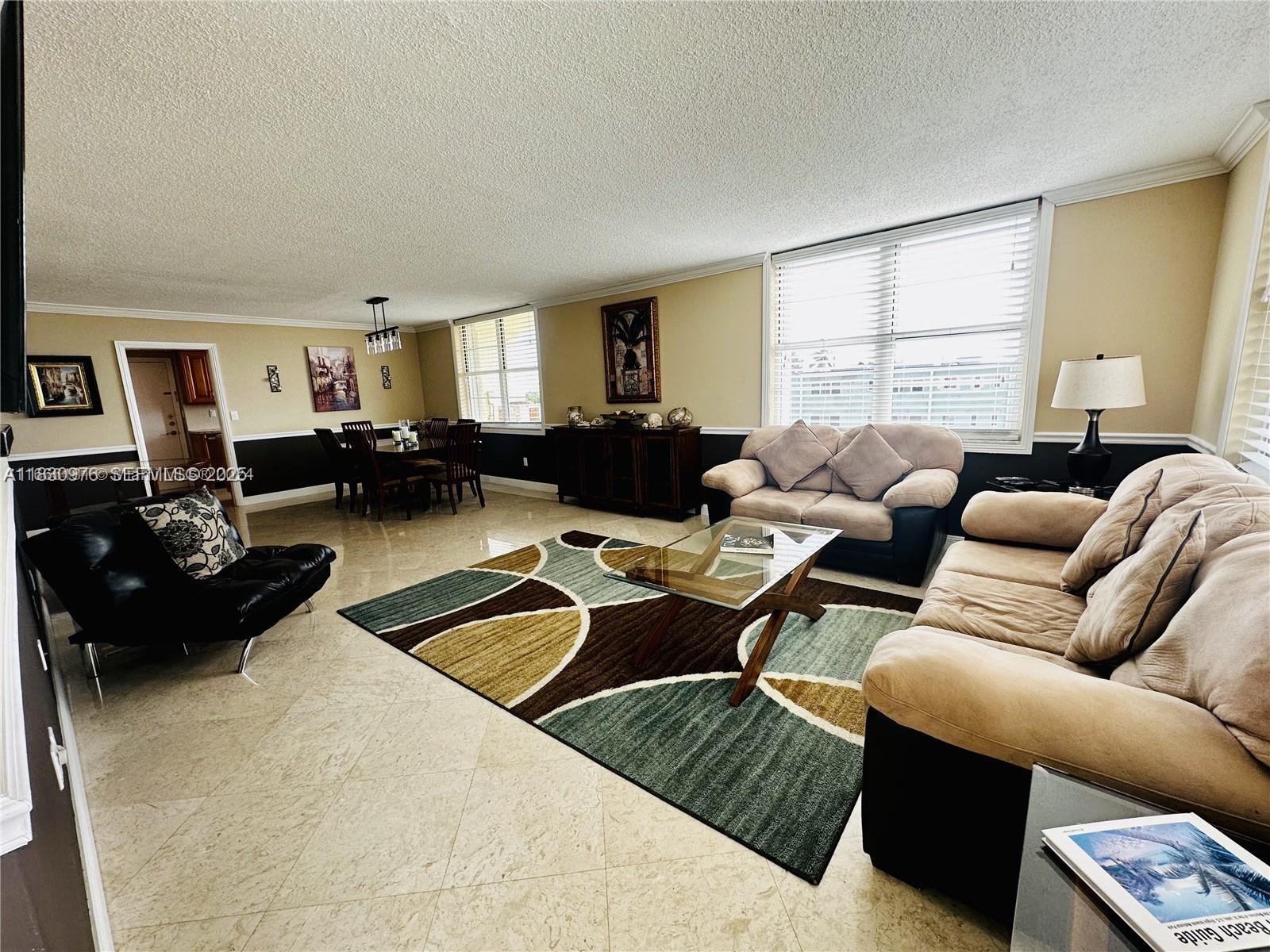 1501 South Ocean Drive, Unit 406 Hollywood, FL 33019 - Photo 2 of 14 a living room with furniture or couch and a window