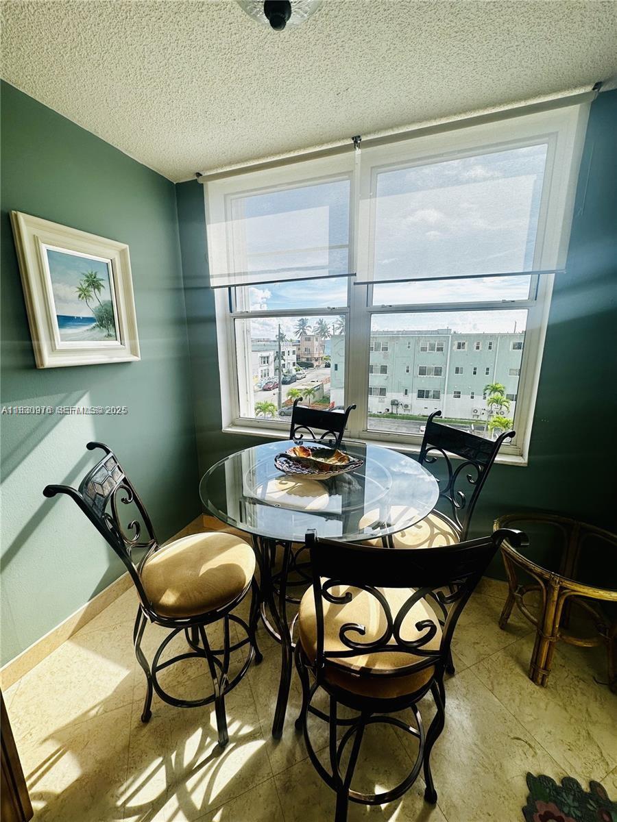 1501 South Ocean Drive, Unit 406 Hollywood, FL 33019 - Photo 9 of 14 a living room with furniture and a large window