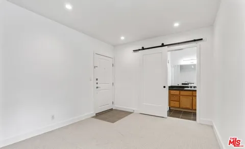 wooden floor in an empty room with a stove