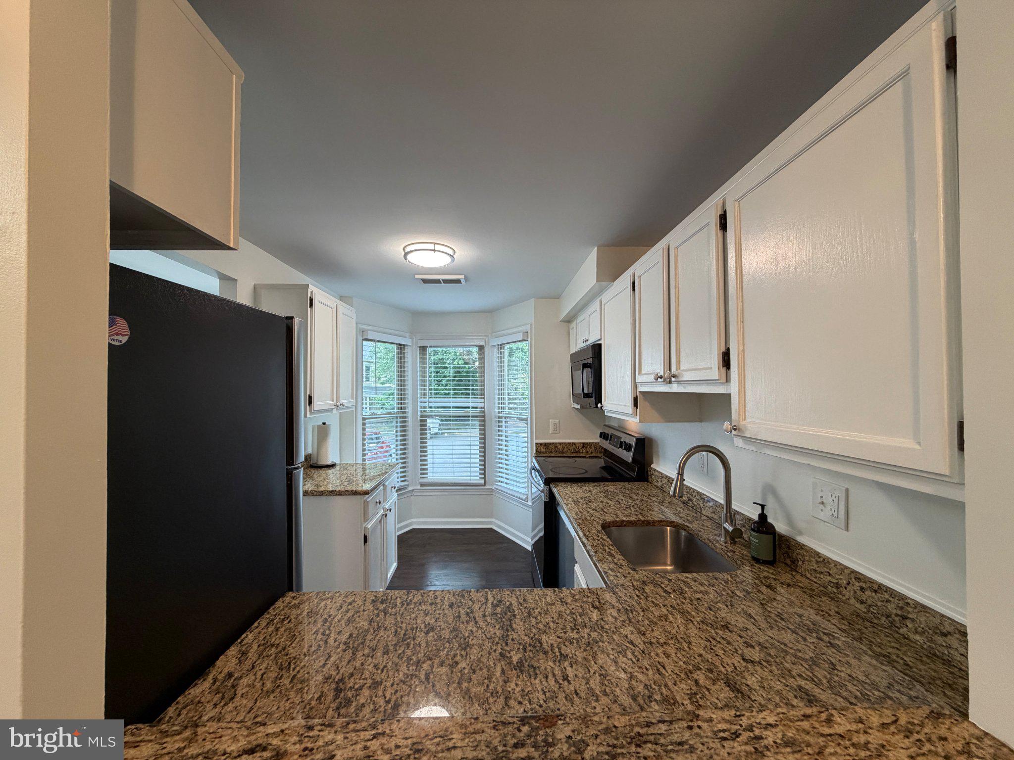 2121 Whisper Way Reston, VA 20191 - Photo 8 of 61 Modern kitchen with natural light.