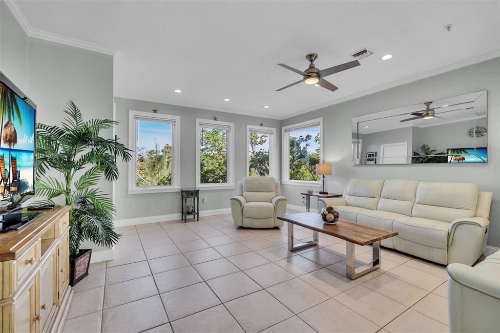 848 Evergreen Way Longboat Key, FL 34228 - Photo 2 of 66 a living room with furniture and a large window