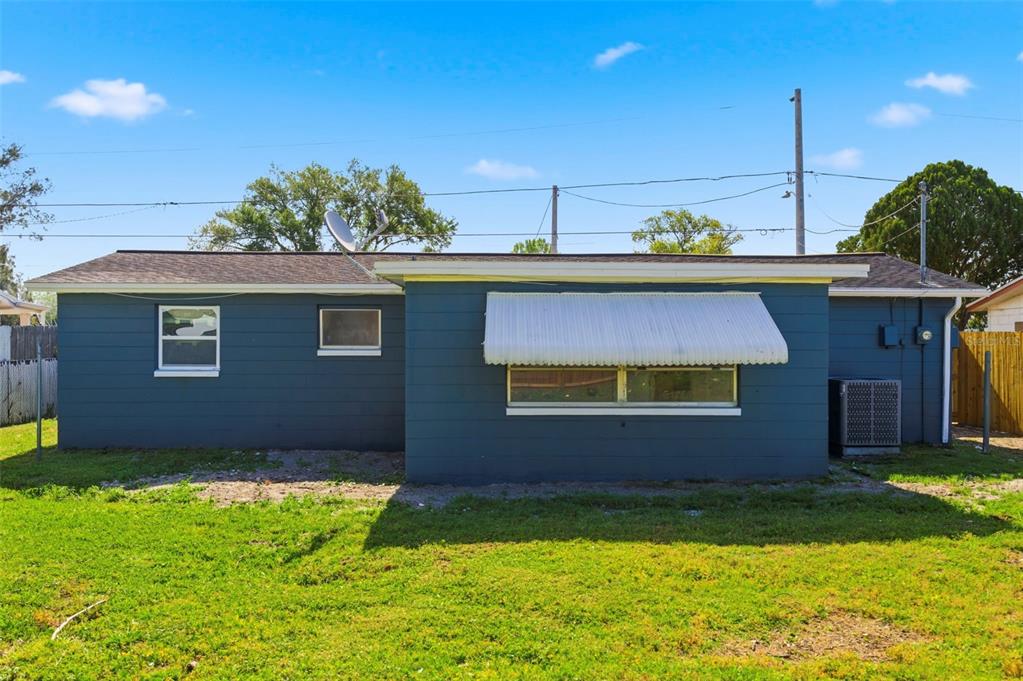 9033 Pegasus Avenue Port Richey, FL 34668 - Photo 39 of 56 a view of a house with a backyard