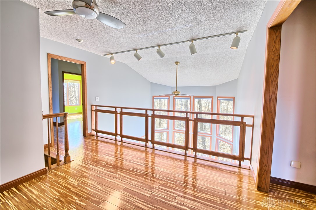 8711 Nicole Lane Springboro, OH 45066 - Photo 60 of 87 This interior hallway features striking bamboo flooring and a captivating view.