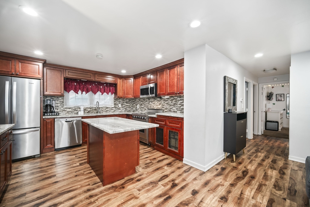 5 Debbie Road Brockton, MA 02302 - Photo 14 of 30 a kitchen with stainless steel appliances granite countertop a refrigerator and a stove top oven