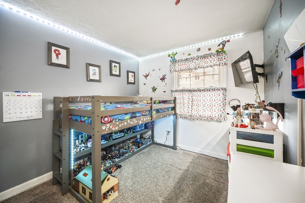 5 Debbie Road Brockton, MA 02302 - Photo 24 of 30 a bedroom with a bed and a tv