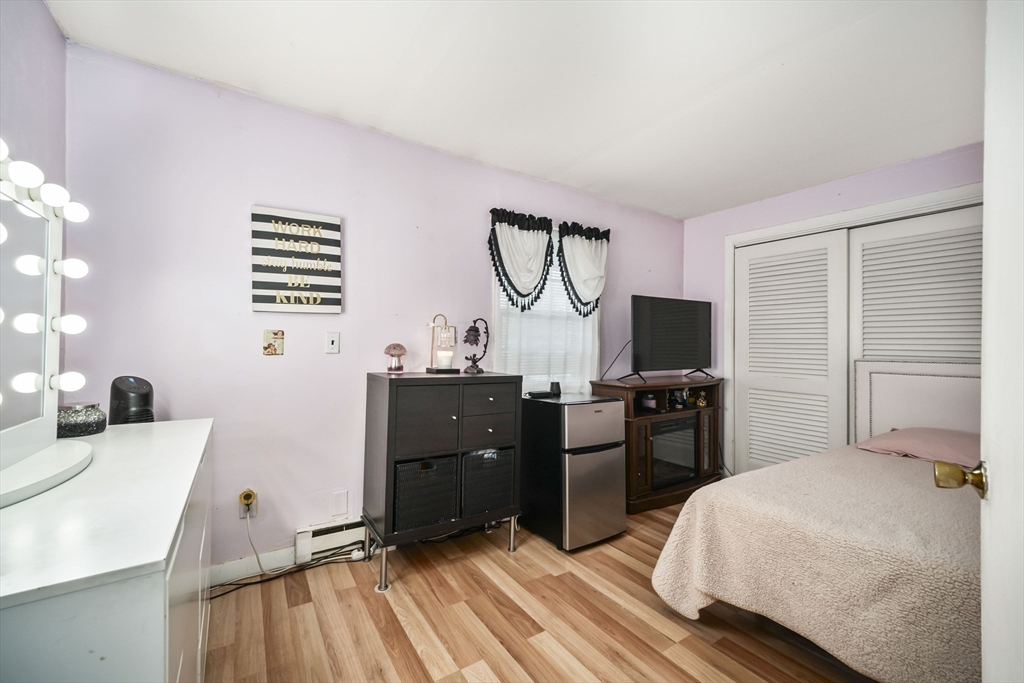 5 Debbie Road Brockton, MA 02302 - Photo 25 of 30 a bedroom with a bed and a flat screen tv