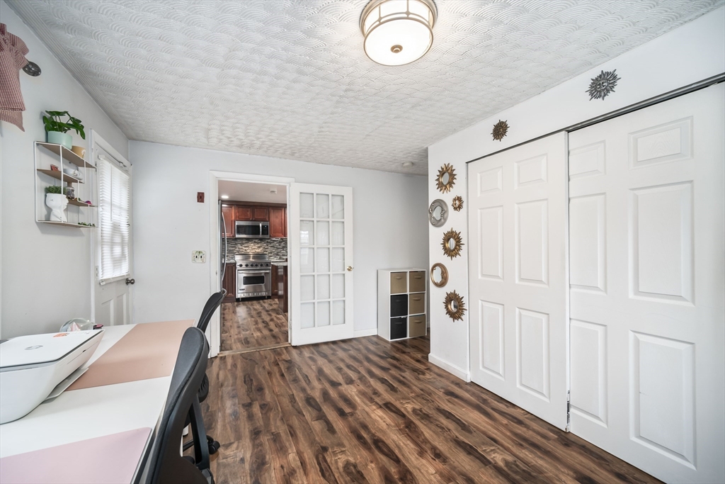 5 Debbie Road Brockton, MA 02302 - Photo 30 of 30 a bedroom with a bed and a chandelier