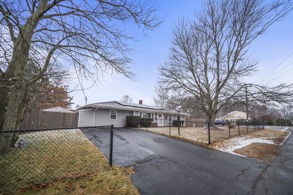 5 Debbie Road Brockton, MA 02302 - Photo 4 of 30 a view of a white house with a large tree