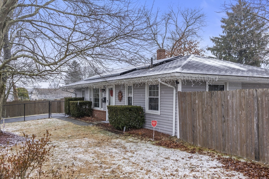 5 Debbie Road Brockton, MA 02302 - Photo 6 of 30 a front view of a house with a yard and garage