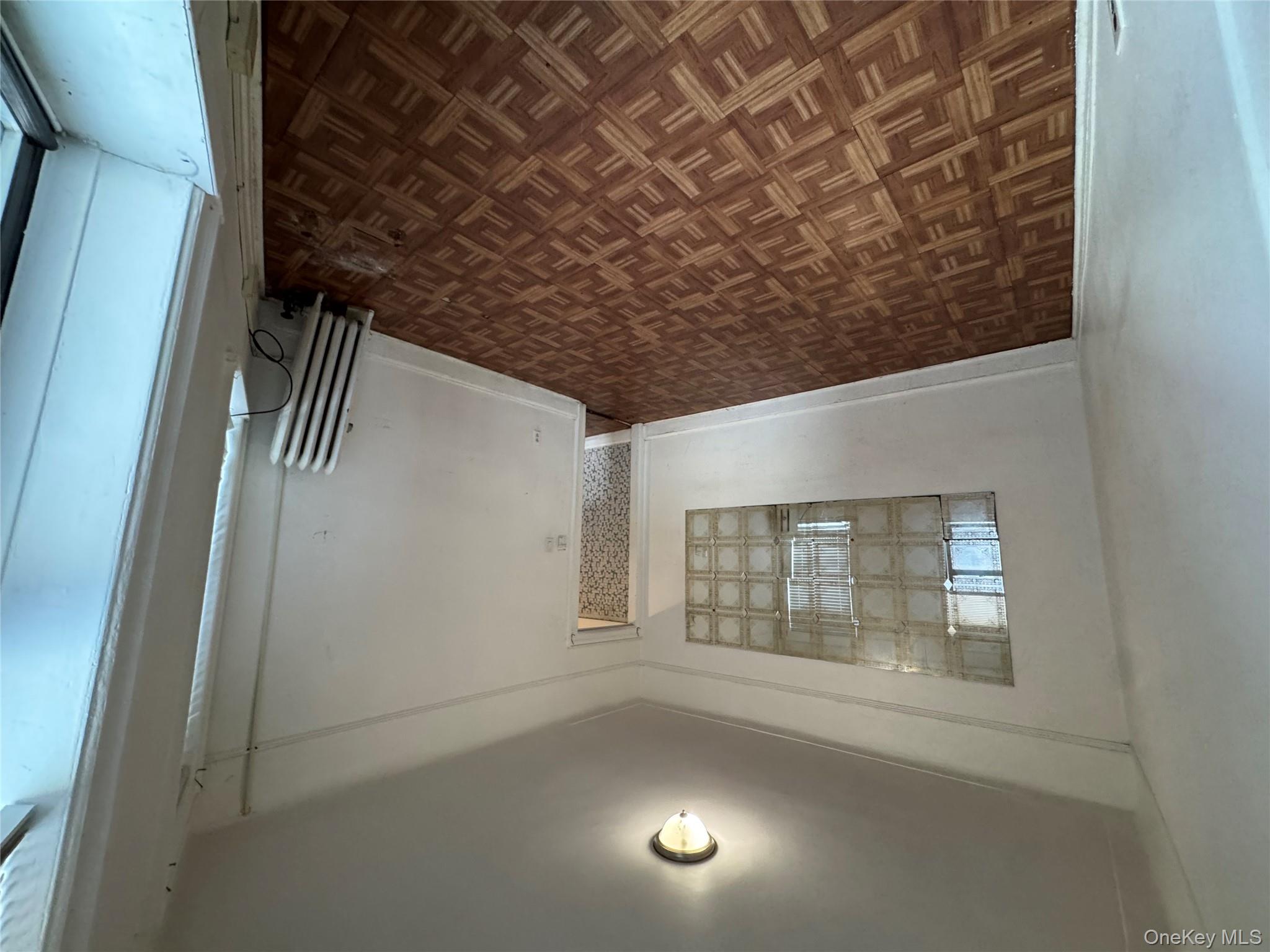 3307 Junction Boulevard, Unit 3 Queens, NY 11372 - Photo 5 of 8 a view of an empty room and window