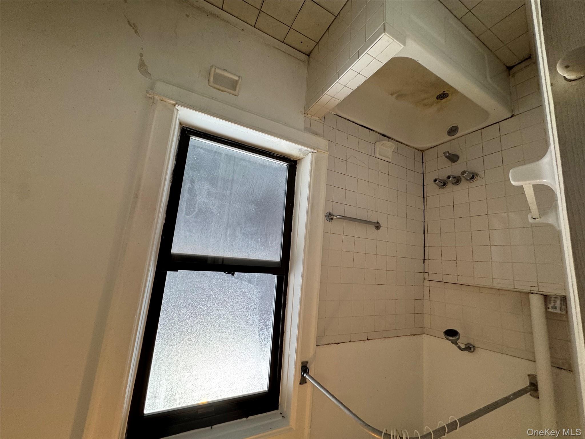 3307 Junction Boulevard, Unit 3 Queens, NY 11372 - Photo 7 of 8 a bathroom with a tub