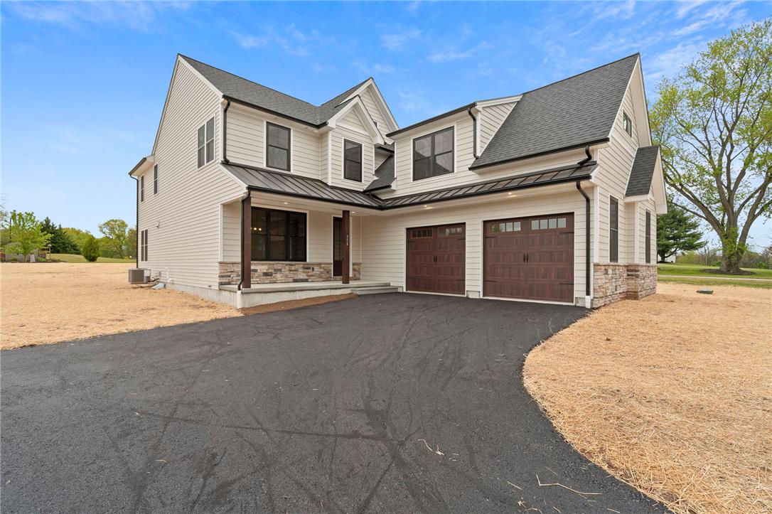 Hottle Road Quakertown, PA 18951 - Photo 6 of 59 Crisp siding, stone accents, and a paved driveway establish exceptional curb appeal.